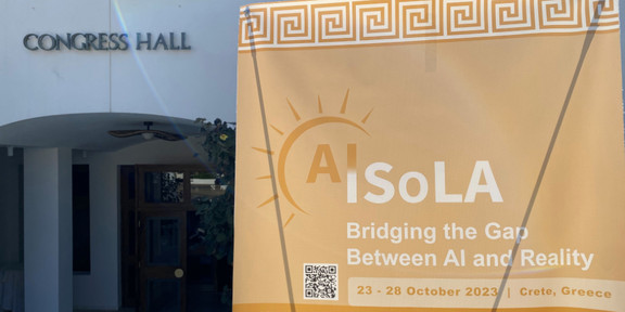 AISoLA Foto eines Banners der AISoLA vor der Congress Hall in Griechenland